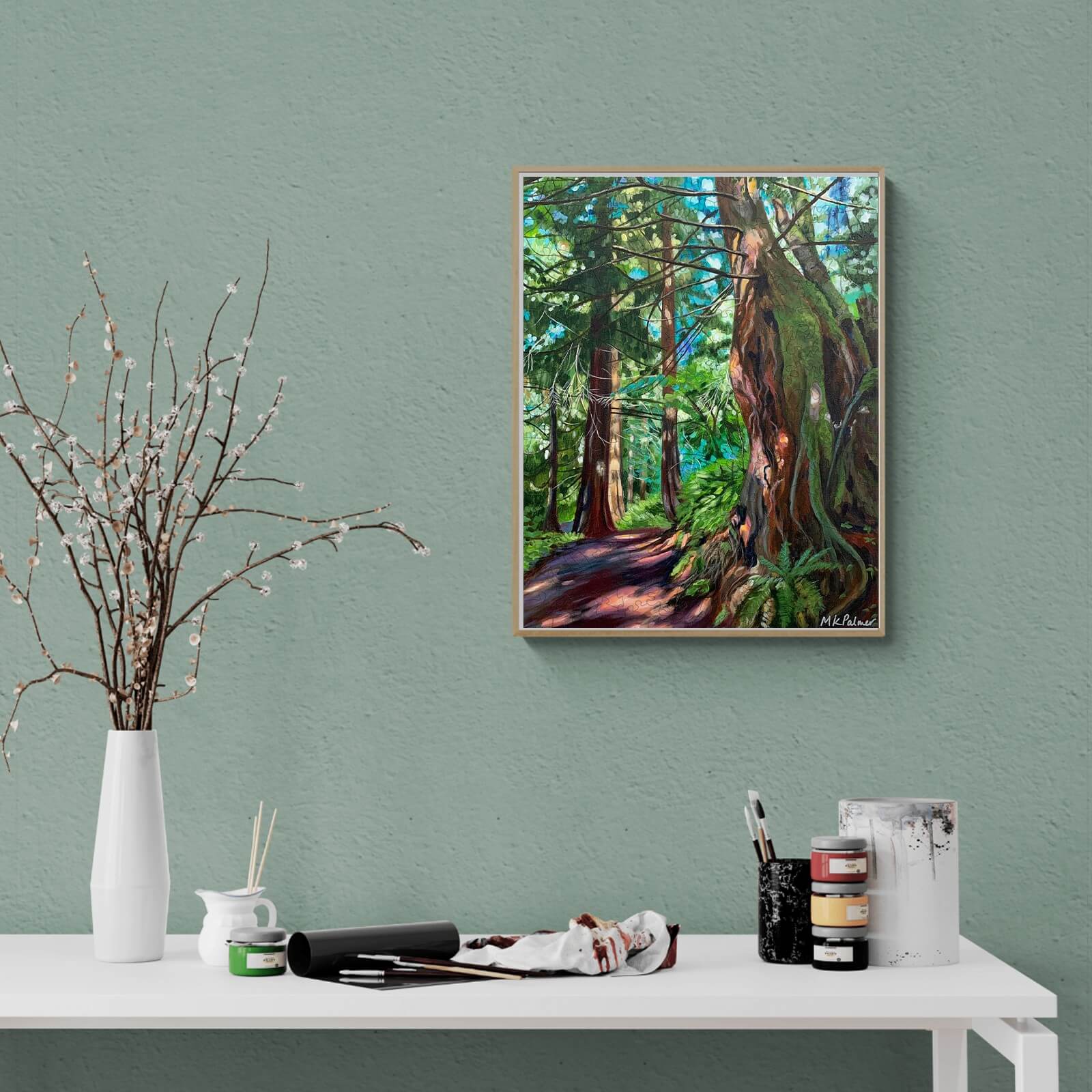 Vibrant painting 'Dappled and Gnarly' by Marianne K Palmer, showcasing a lush forest scene on a green wall.