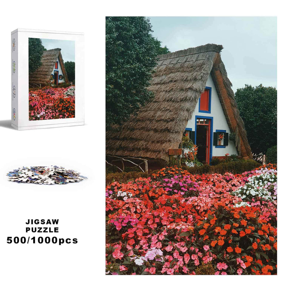 Flower House jigsaw puzzle with 500/1000 pieces, featuring a vibrant flower garden and a charming thatched-roof cottage.