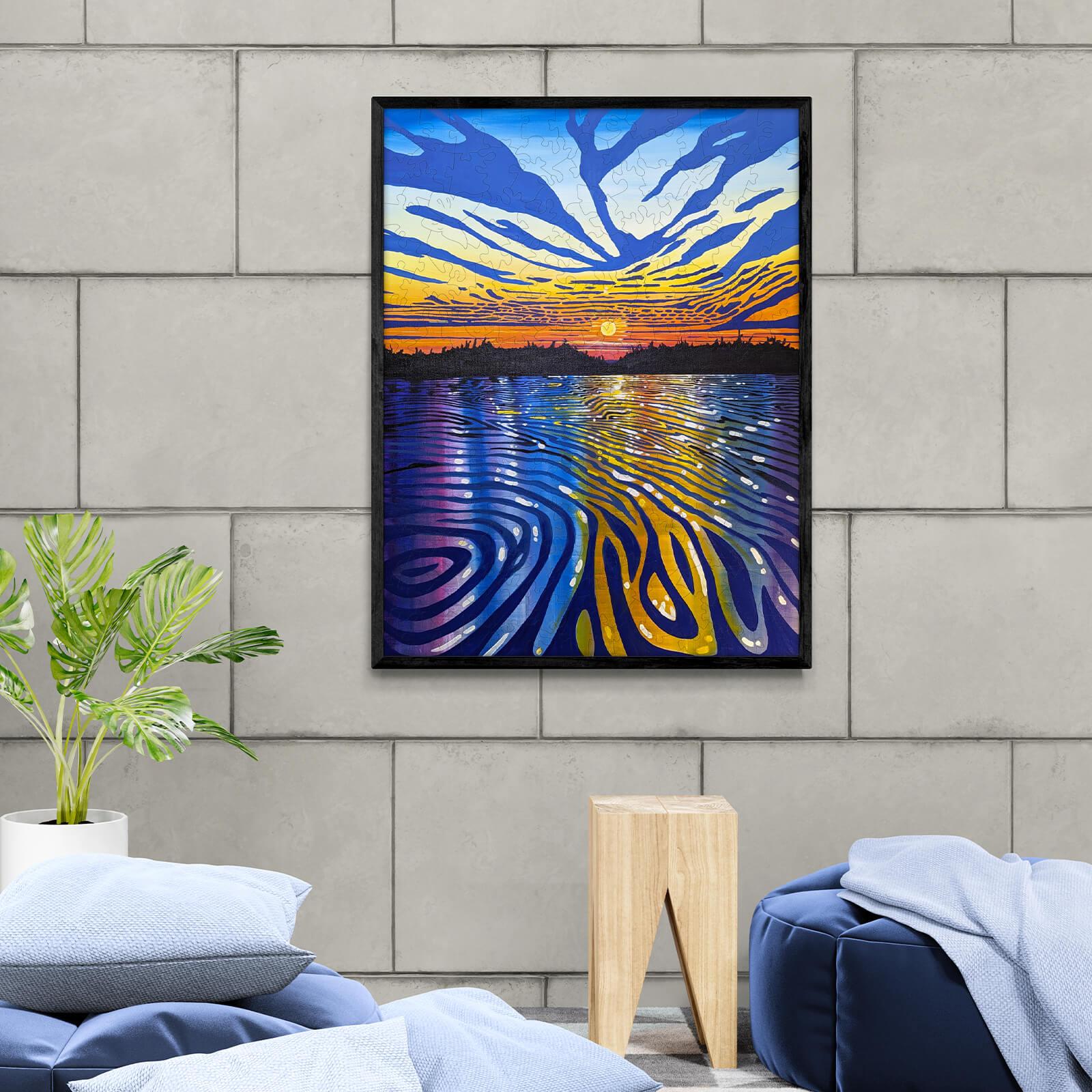 Vibrant painting 'Long River' by Sarah Bradfield, showcasing sunset colors reflecting on water, stylishly displayed in modern decor.