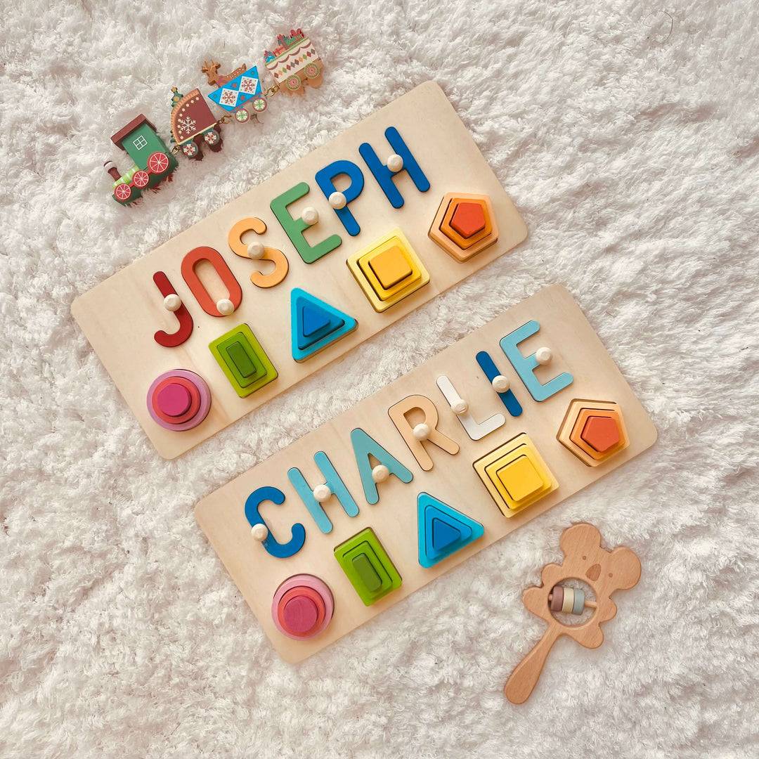 Personalized wooden stacking toy with the names Joseph and Charlie, featuring colorful shapes for educational play.