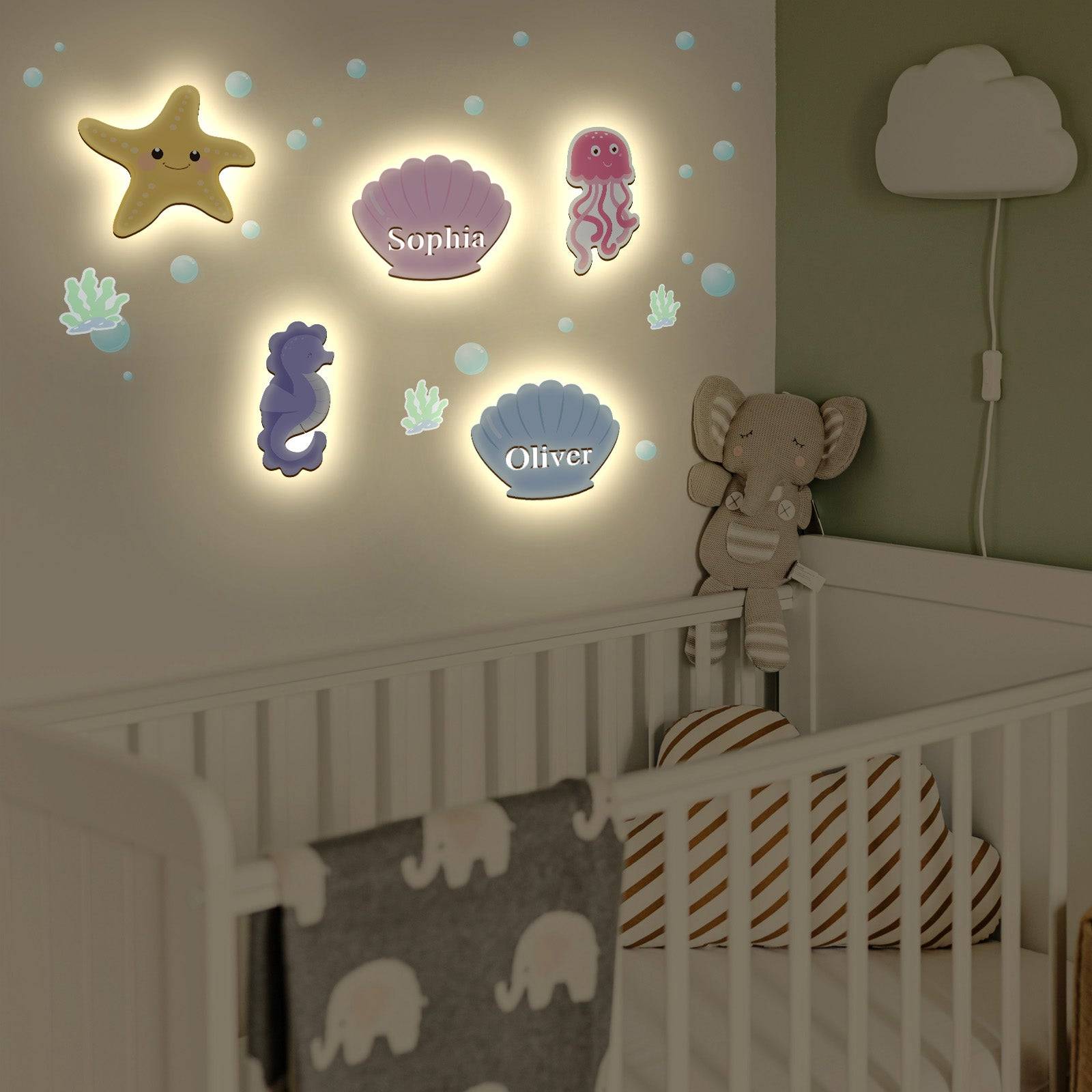Personalized marine theme wall light set featuring starfish, seashells, and jellyfish in a child's nursery.