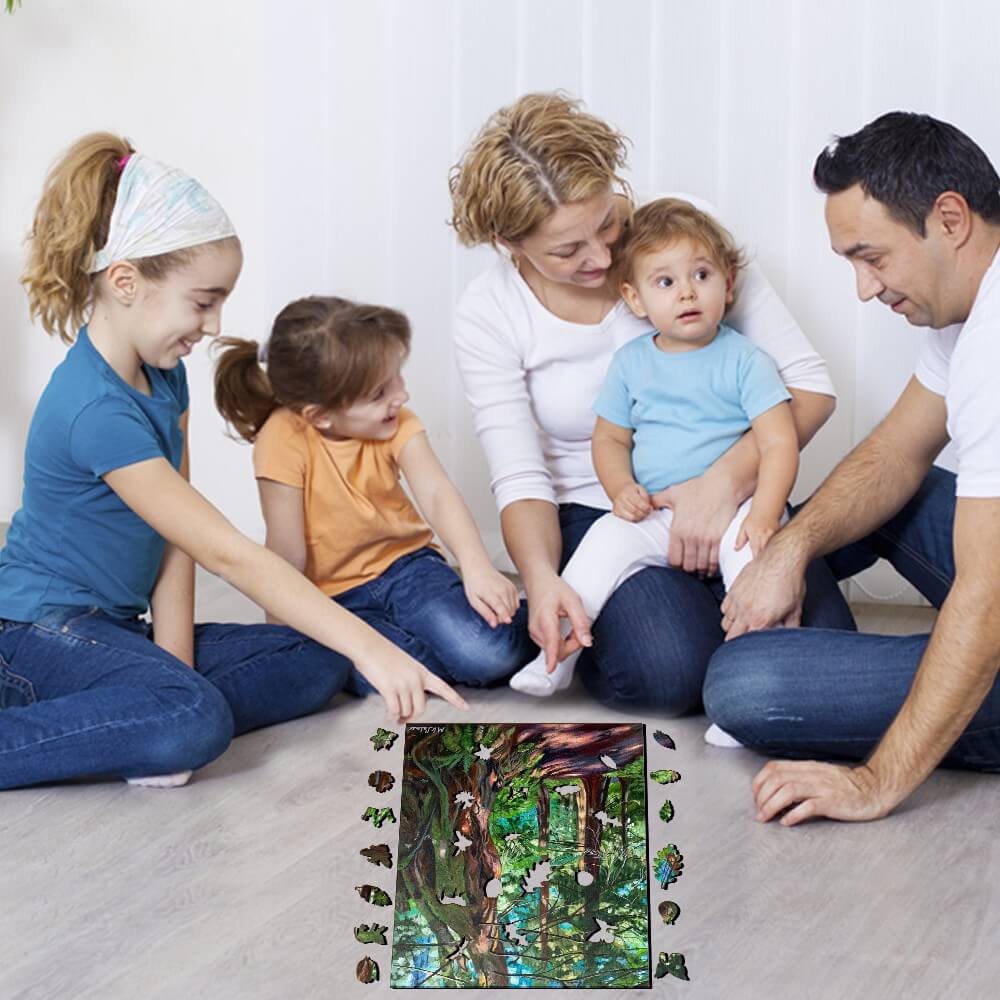 Family playing games together on the floor, enjoying quality time with kids in a joyful indoor setting.
