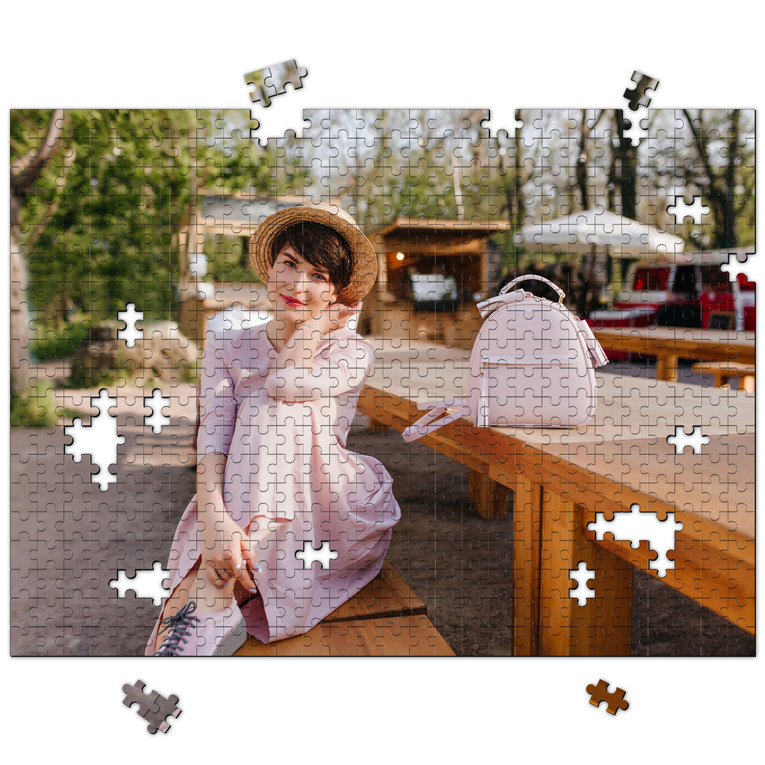 Personalized jigsaw puzzle featuring a young woman in a pink dress enjoying a sunny day outdoors.