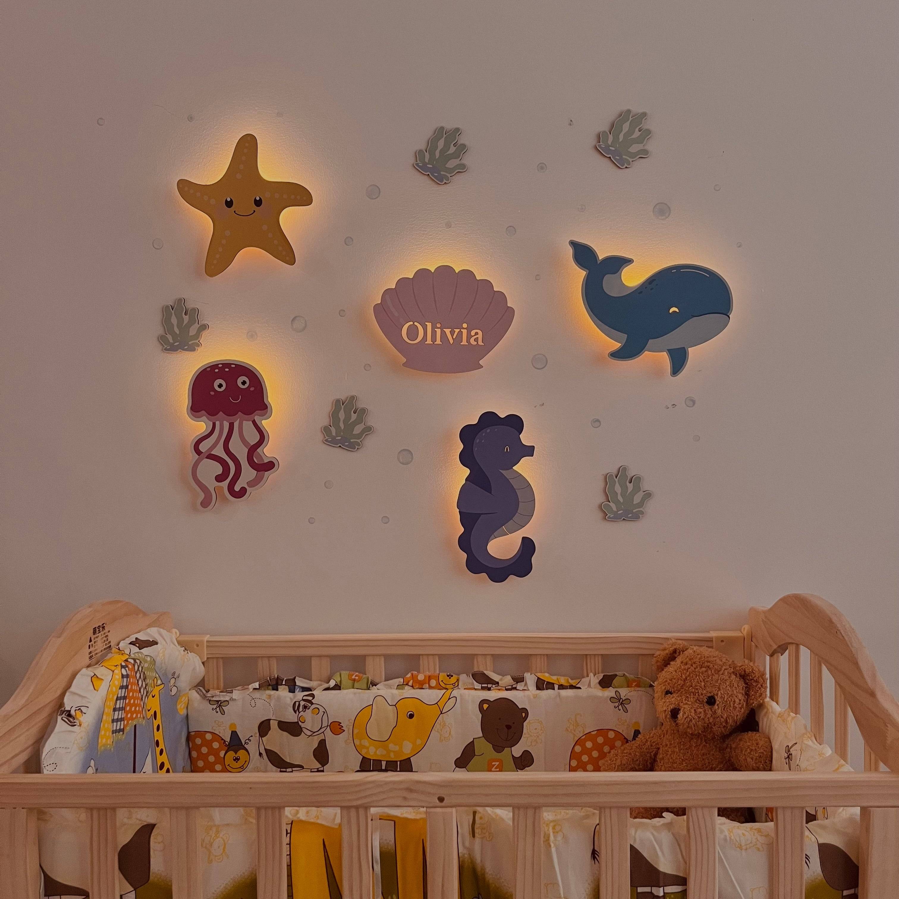 Personalized marine theme wall lights for kids' room, featuring starfish, whale, and sea creatures decor.
