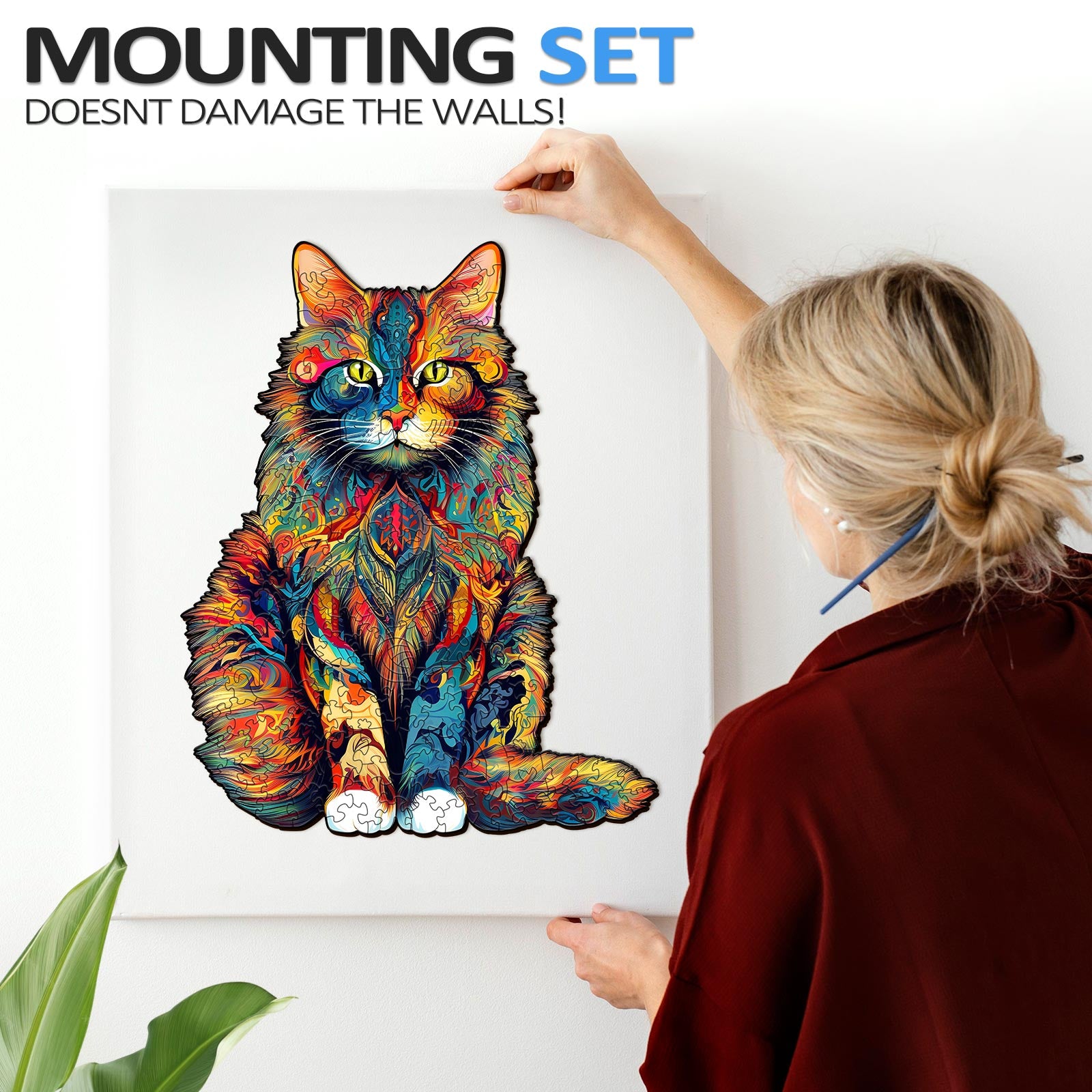 Colorful Maine Coon cat art being mounted on the wall with a user-friendly mounting set.