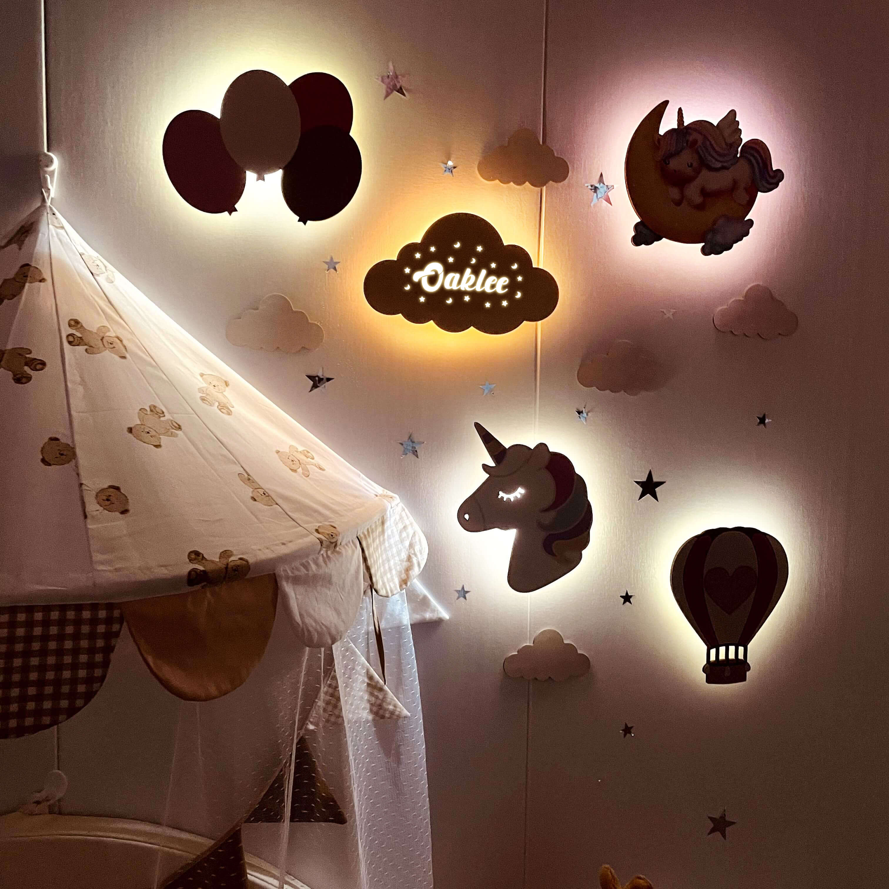 Personalized wooden baby room wall light set featuring balloons, clouds, a unicorn, and hot air balloon for soothing ambiance.