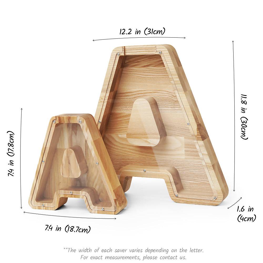 Personalized wooden letter piggy bank in letter A shape with dimensions, crafted from ash tree wood.