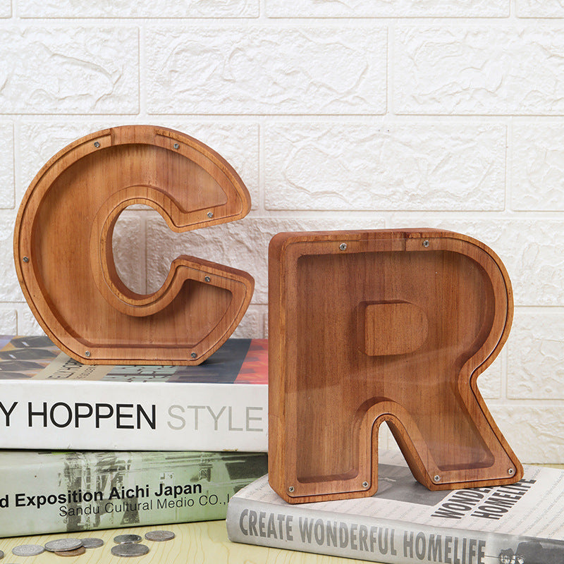 Personalized wooden letter piggy bank, unique kids gift, teaching savings with stylish design.